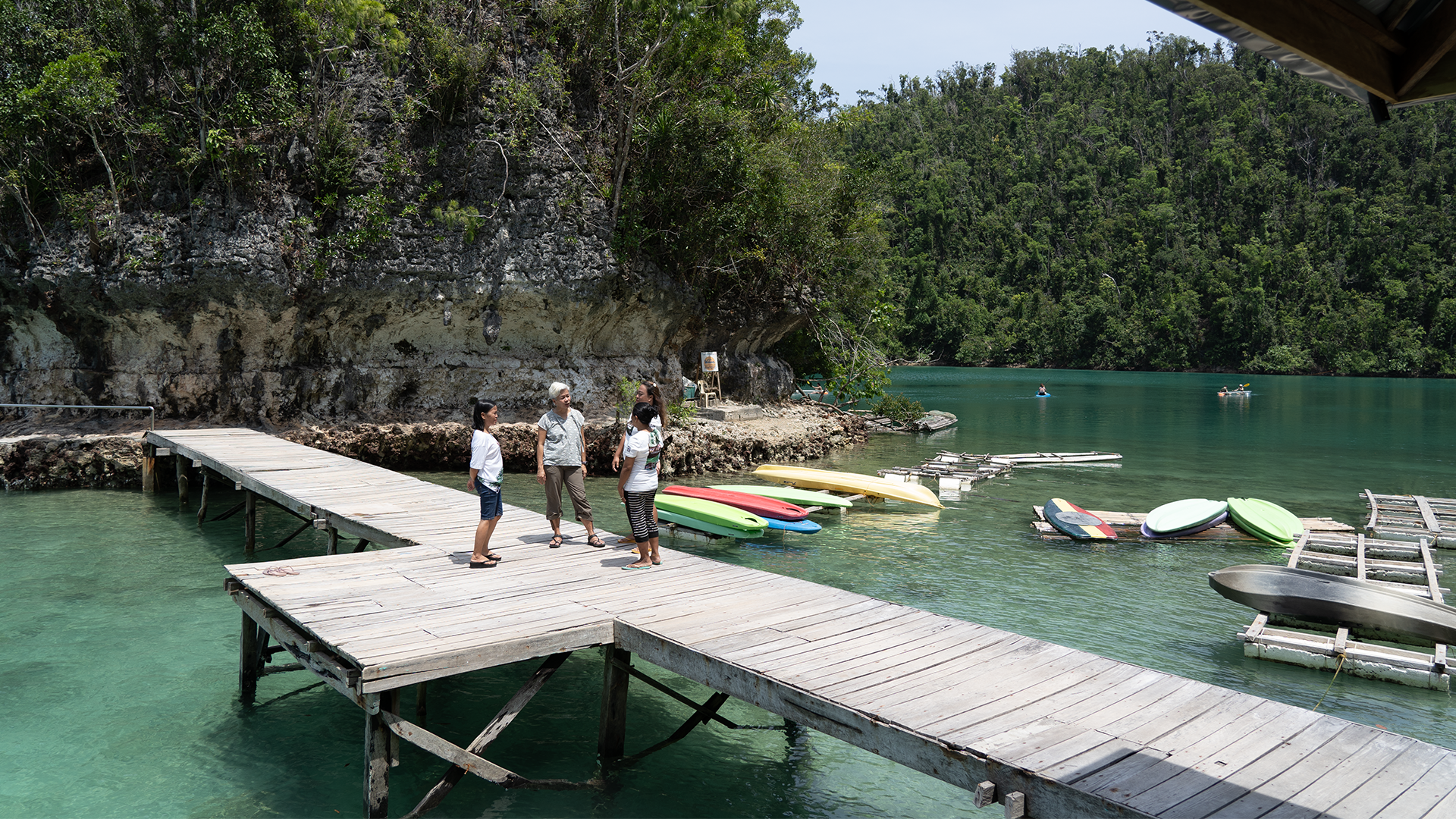 Photo of Fish Forever Managing Director, Rocky Sanchez Tirona speaking to others on a dock in The Philippines.